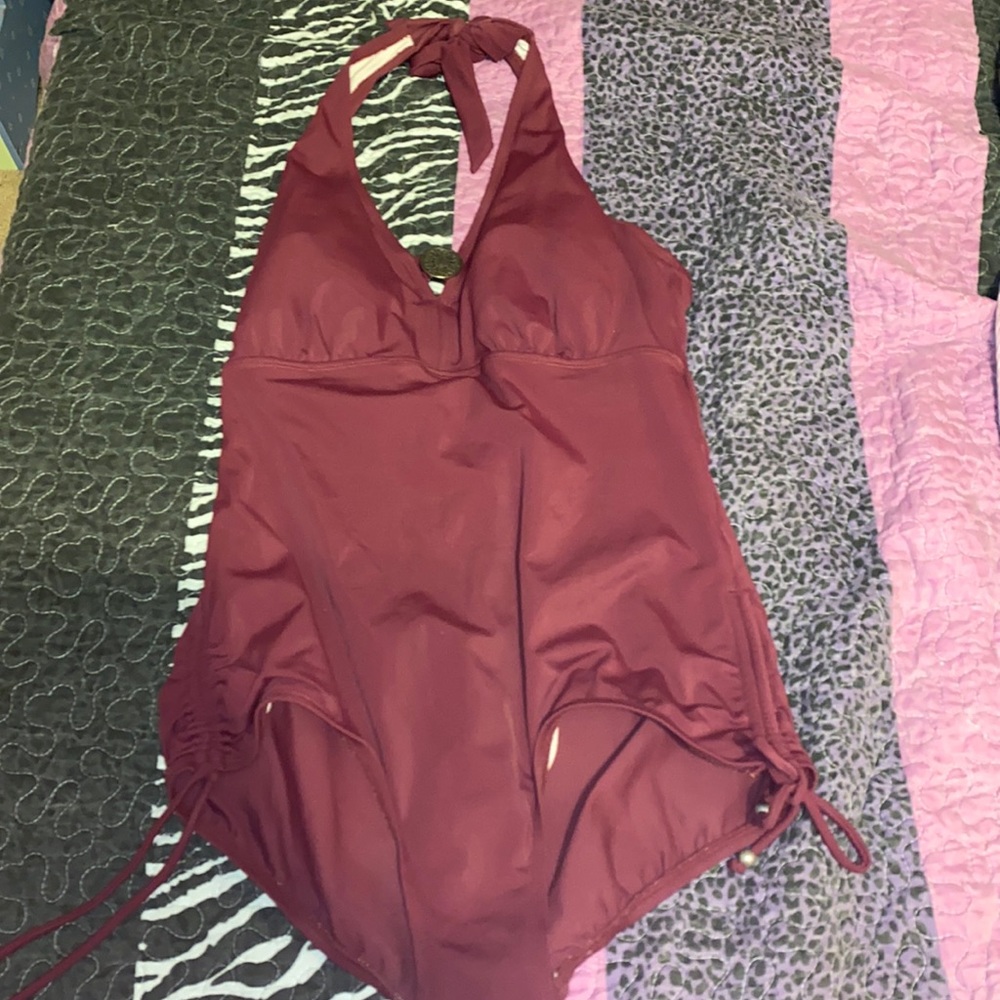 Maroon color halter top bathing suit.